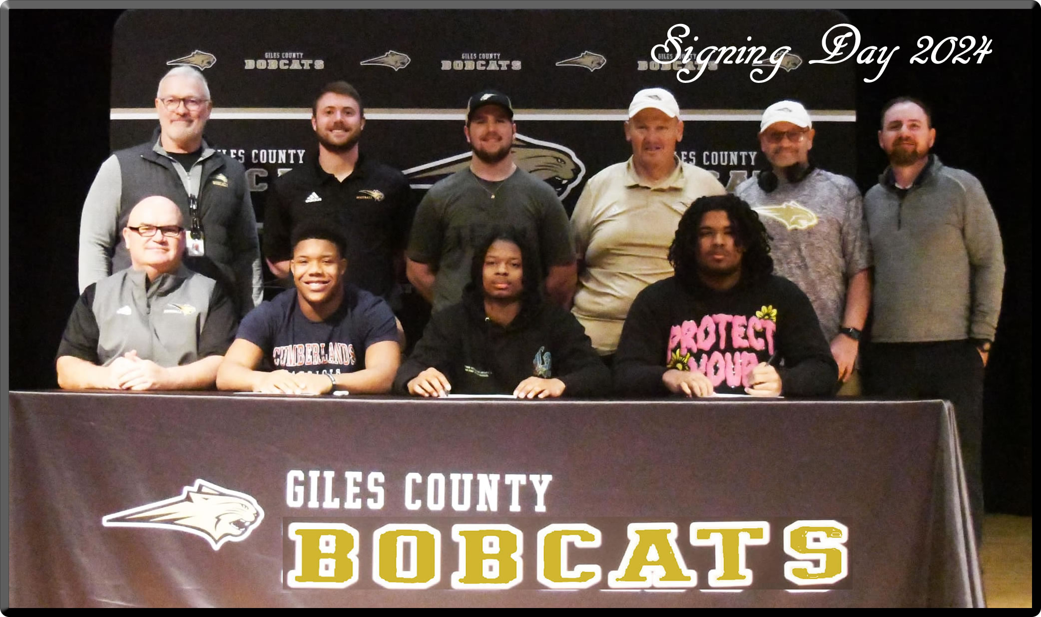 Giles County Bobcats Football Players with Coaches on Signing Day