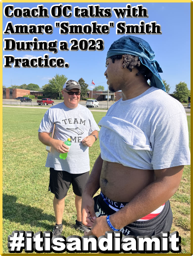 Coach OC talks with Amare Smith during a Bobcats Football Practice 2023