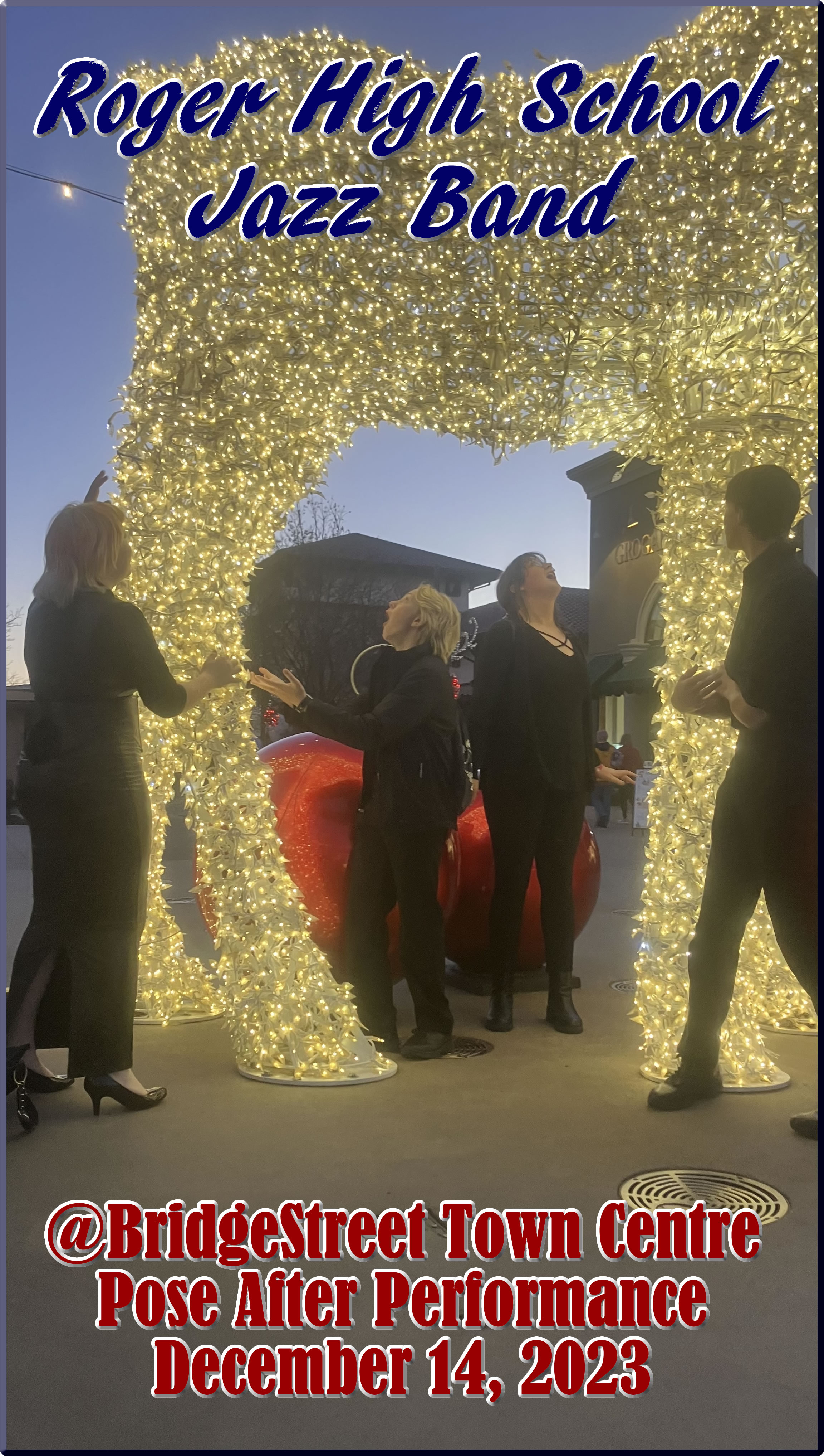 Rogers Jazz Band members pose by reindeer Christmas lights at Bridge Street Town Center